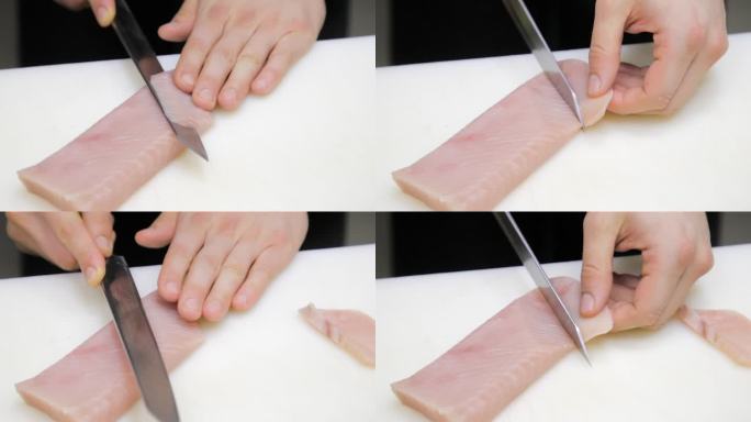 厨师手切金枪鱼片做寿司