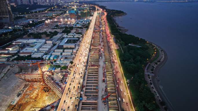 航拍深圳湾超级总部建设傍晚亮灯场景