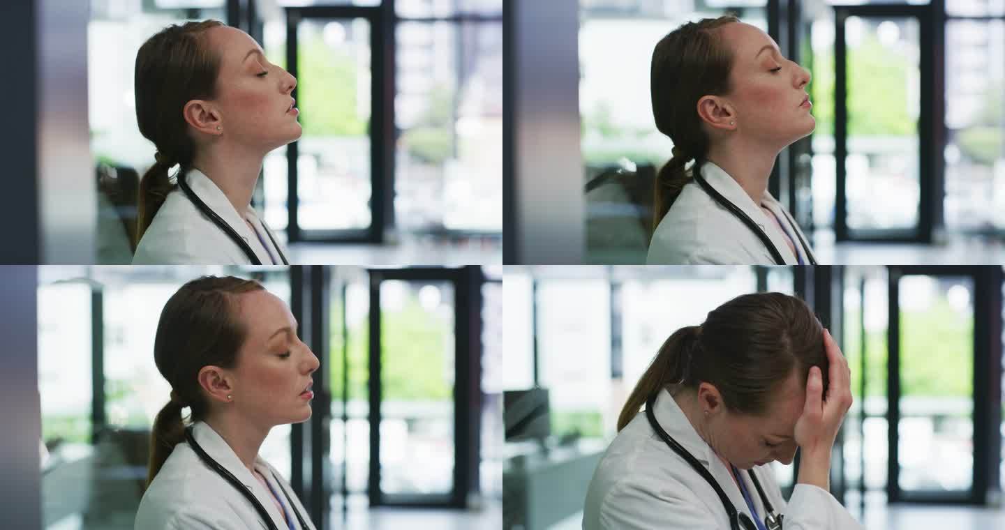 一个漂亮的年轻医生独自站在诊所感到心烦的4k视频片段