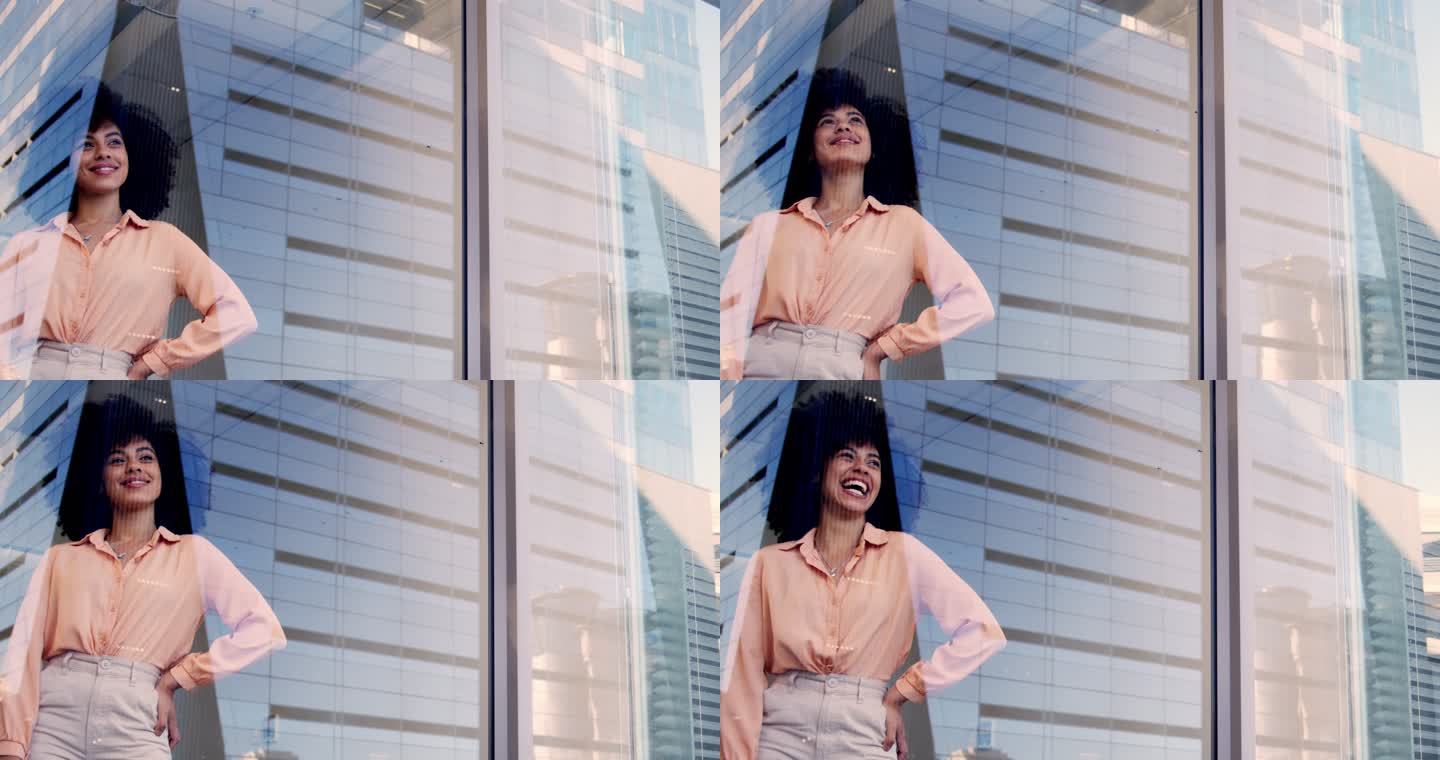 一个快乐的年轻女商人从办公室的窗户望出去思考。一个微笑的女人，站在城市的一个建筑窗户旁，看上去很沉思