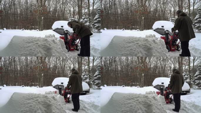 冬季暴风雪过后，一名男子正在清理覆盖着积雪的汽车周围的车道。他正在启动抛雪机。