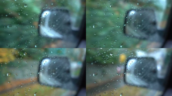 雨中，延时水滴落在车窗玻璃侧视镜汽车背景上。