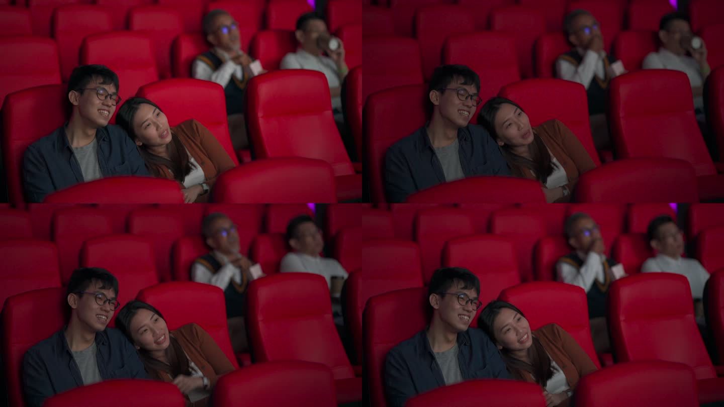 亚裔中国年轻夫妇喜欢在电影院看电影