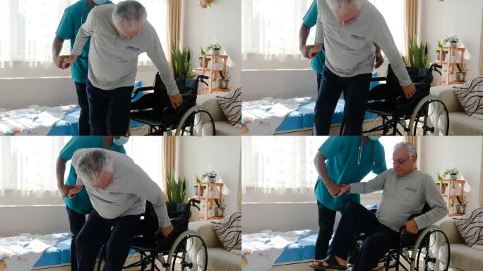 在疗养院轮椅上帮助老人的男护士
