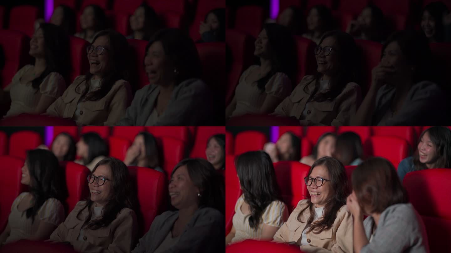 亚裔中国成熟女性和她的朋友在电影院看电影