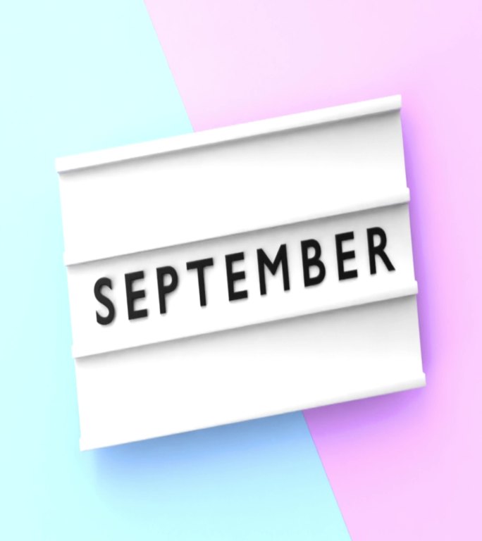 垂直九月文本以4K分辨率显示在蓝色和粉红色背景的灯箱上