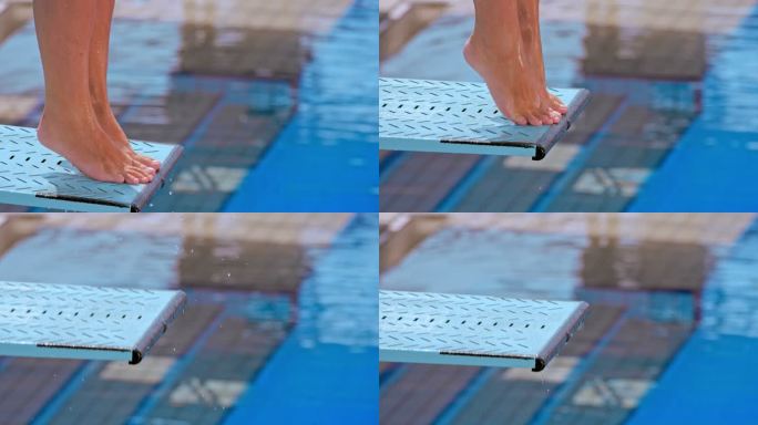 一名女潜水员从跳板上跳入游泳池的脚