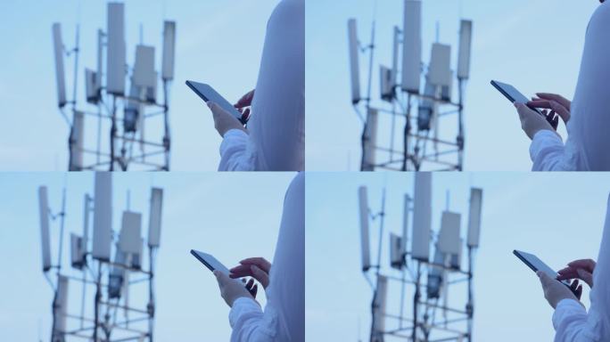 在4G、5G通信塔附近使用手机的人手