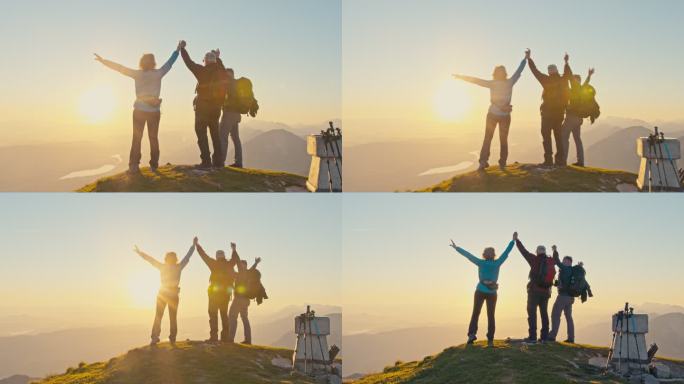 日落时，斯洛莫徒步旅行者在山顶上举起手臂