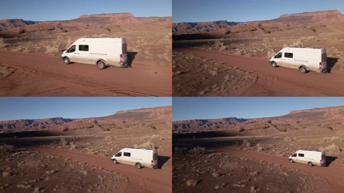 在科罗拉多州/犹他州南部莫阿布附近西南沙漠的一条土路上，一架无人驾驶的DIY露营车在行驶