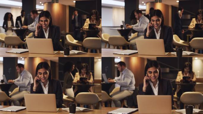 一个年轻女商人在会议休息室用笔记本电脑工作时用手机通话的4k视频片段