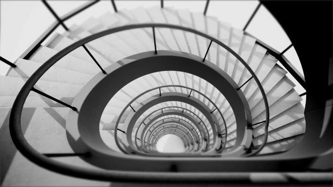 广角黑白视频描绘了螺旋楼梯的抽象高角度视图。