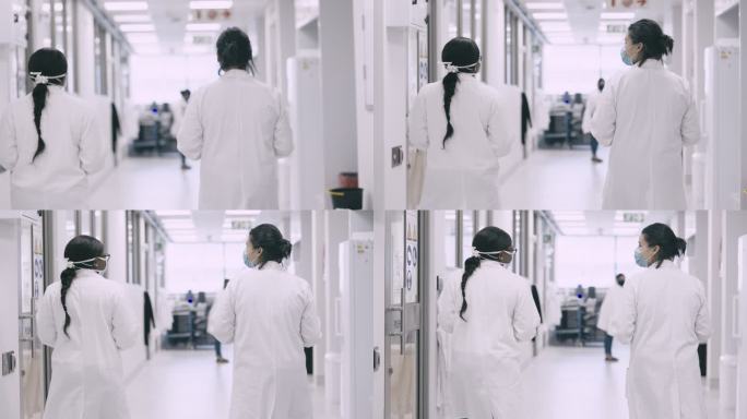 4k视频后视画面，两名不知名的年轻科学家走进实验室进行医学研究