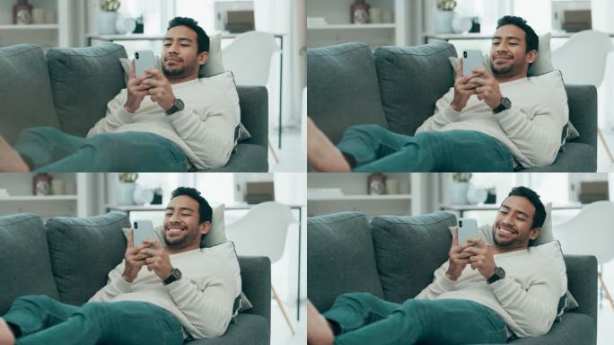 一个年轻人在沙发上放松，同时使用智能手机的4k视频片段