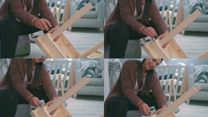 一名年轻女子在家中婴儿托儿所从事木制项目的4k视频片段