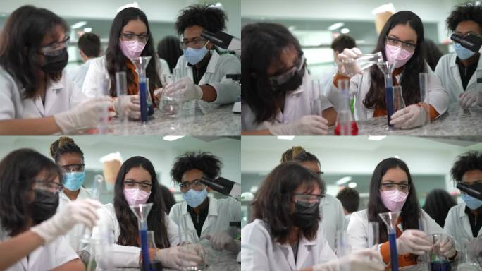 在课堂上，老师在实验室帮助学生做实验