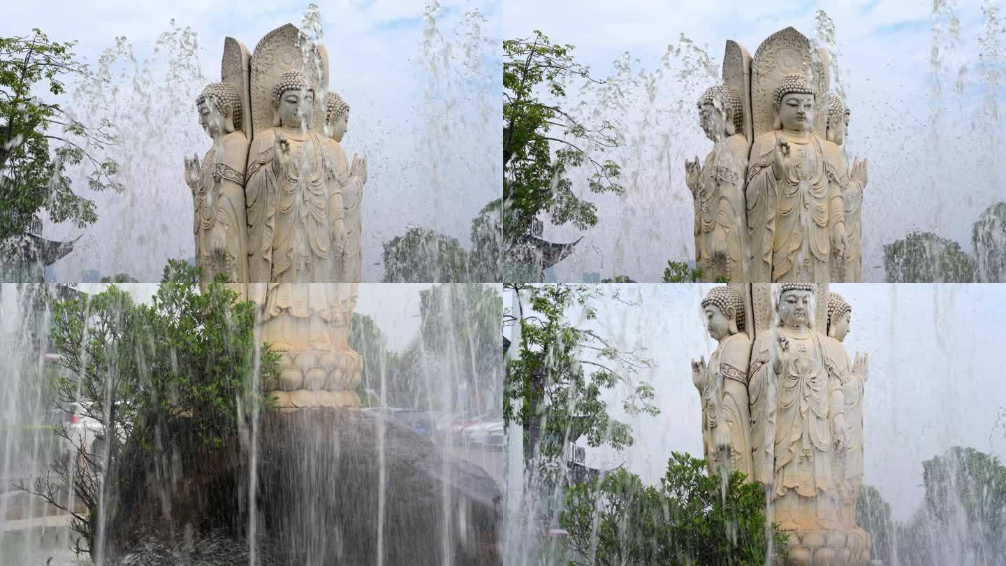 观音石雕像摆在中间的喷泉水池