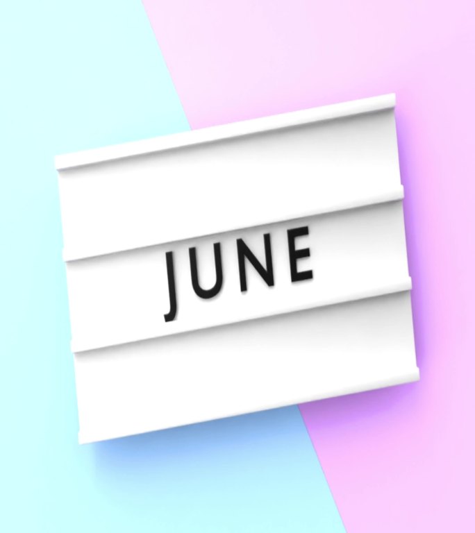 垂直六月文本以4K分辨率显示在蓝色和粉红色背景的灯箱上