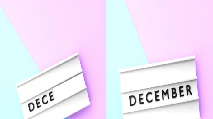 垂直12月文本以4K分辨率显示在蓝色和粉红色背景的灯箱上