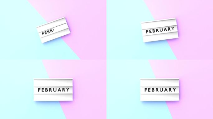二月文本以4K分辨率显示在蓝色和粉红色背景的灯箱上