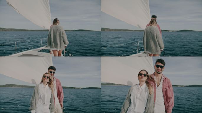 斯洛-莫：一对富有的年轻夫妇在帆船甲板上摆姿势