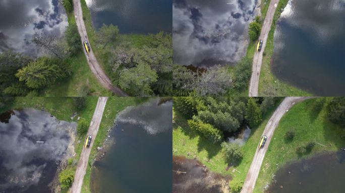 在土路上驾驶皮划艇的汽车鸟瞰图。当地的公路旅行。