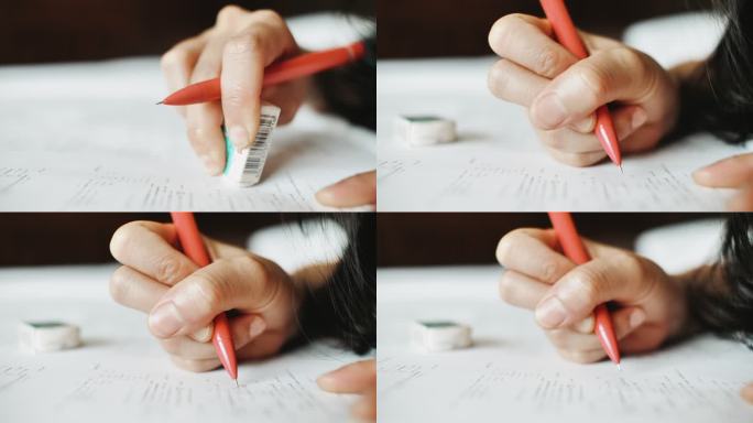 特写妇女在纸上阅读，翻页，用铅笔在文件上标记文字