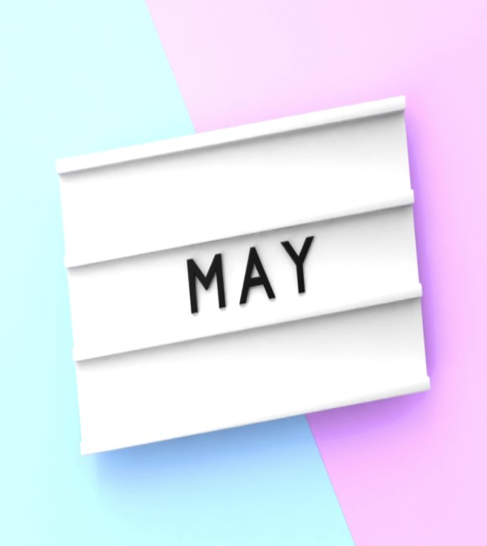 垂直五月文本以4K分辨率显示在蓝色和粉红色背景的灯箱上