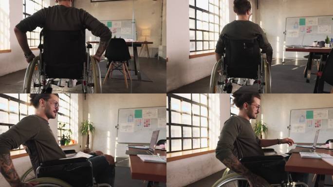 在办公室用笔记本电脑工作的残疾创意人。