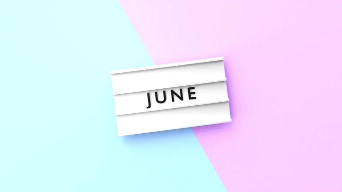 六月文本以4K分辨率显示在蓝色和粉红色背景的灯箱上