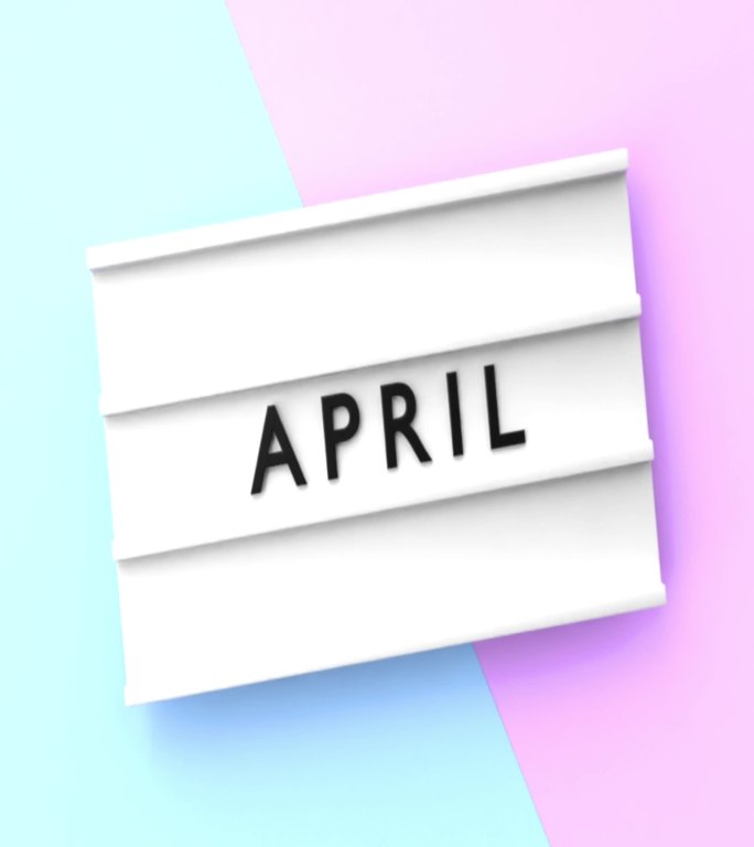 垂直四月文本以4K分辨率显示在蓝色和粉红色背景的灯箱上