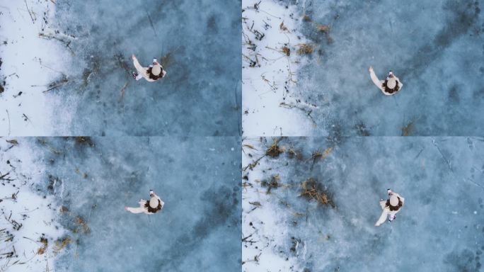 上图：一名女子在冰冻的湖面上滑冰时使用手机的照片