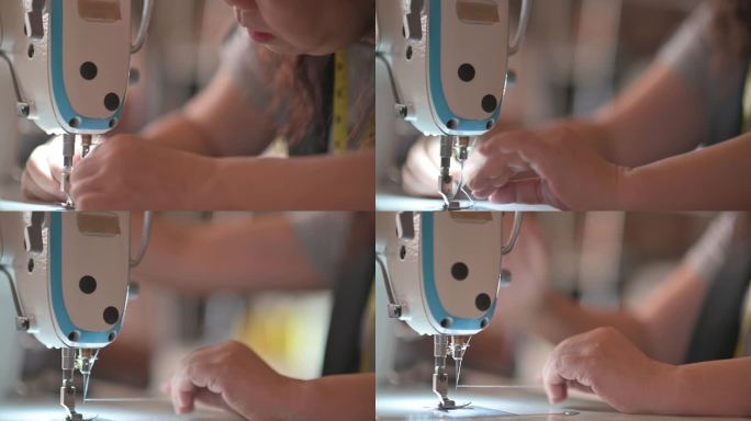 亚洲中国女裁缝手工缝制过程的特写，在缝纫机上缝合。