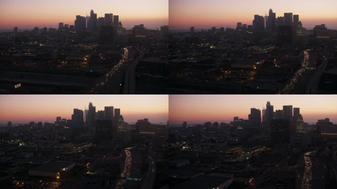 黄昏时分，一架飞机接近洛杉矶市中心