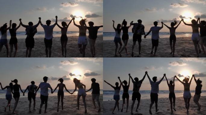 剪影一群朋友在海滩上玩得很开心。快乐和微笑的朋友们在海边奔波，去远洋度假旅行。假期-伊斯托克