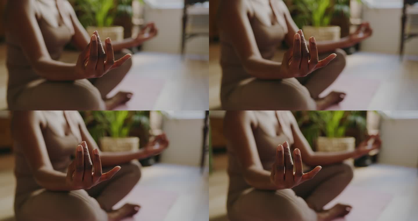 一个面目全非的女人在家中以莲花姿势冥想的4k视频片段