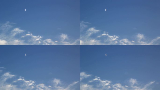 在蓝天白云的空中飞机飞过了一弯明月