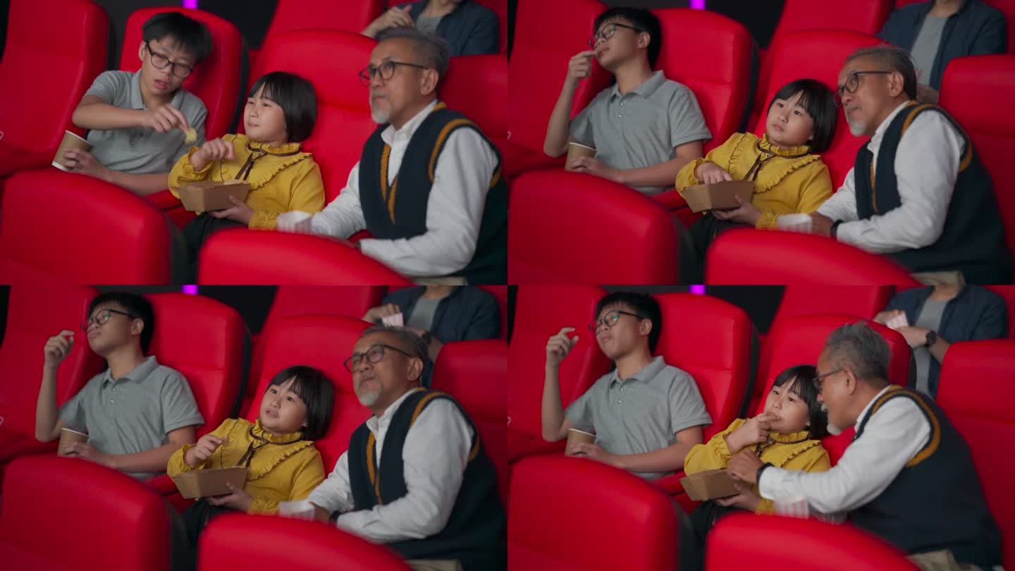 亚裔华人活跃的老人和他的孙子喜欢在电影院看电影