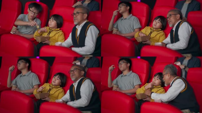 亚裔华人活跃的老人和他的孙子喜欢在电影院看电影