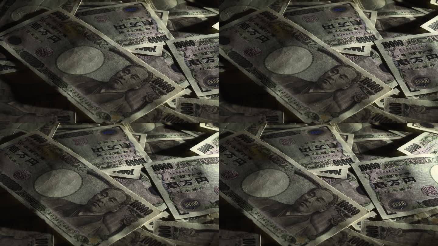 桌子上到处都是10000日元的钞票。摇镜头。