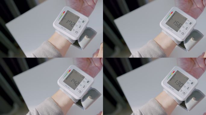 老年人手腕监护仪检查血压，将她的血压数据记录在笔记本上