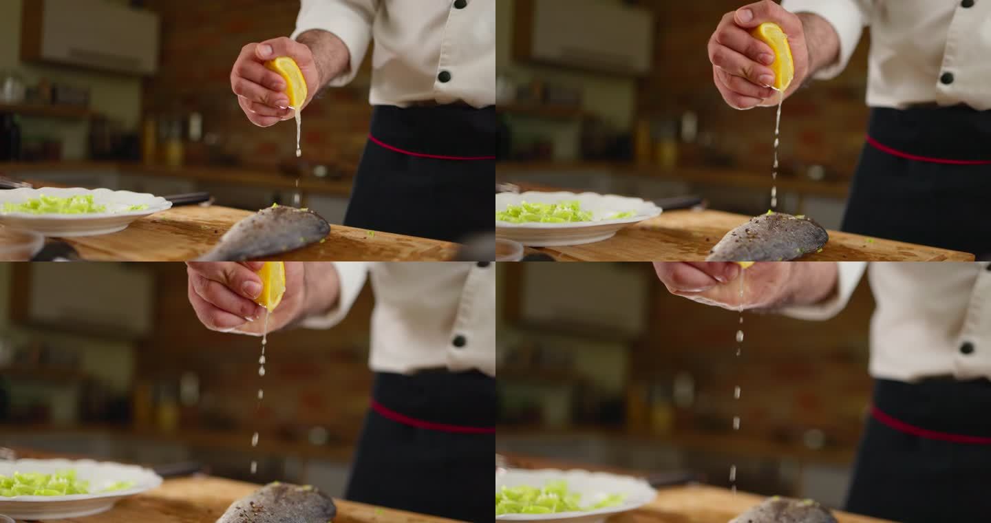 一个不知名的厨师在鱼上挤柠檬汁的特写镜头。