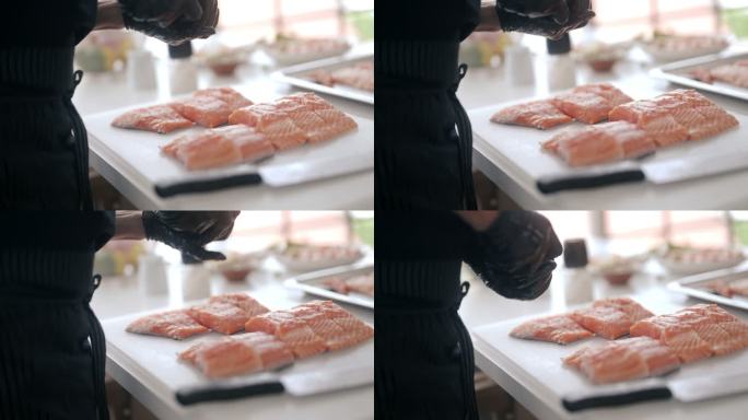 一位日本厨师正在做鲑鱼牛排