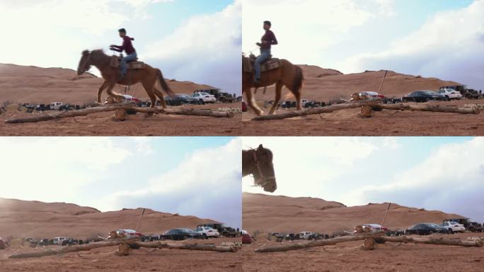 黄昏前的傍晚，在亚利桑那州的纪念碑谷纳瓦霍部落公园，一个十几岁的纳瓦霍女孩骑在马上跳跃，训练小马，让