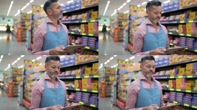 一名男子在超市使用数字平板电脑工作的肖像