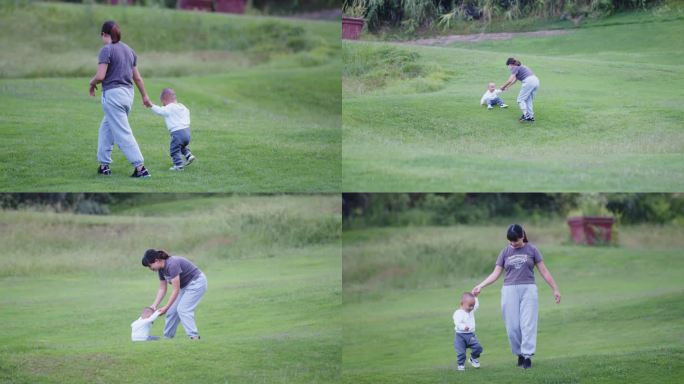 母亲带孩子在草坪上玩耍