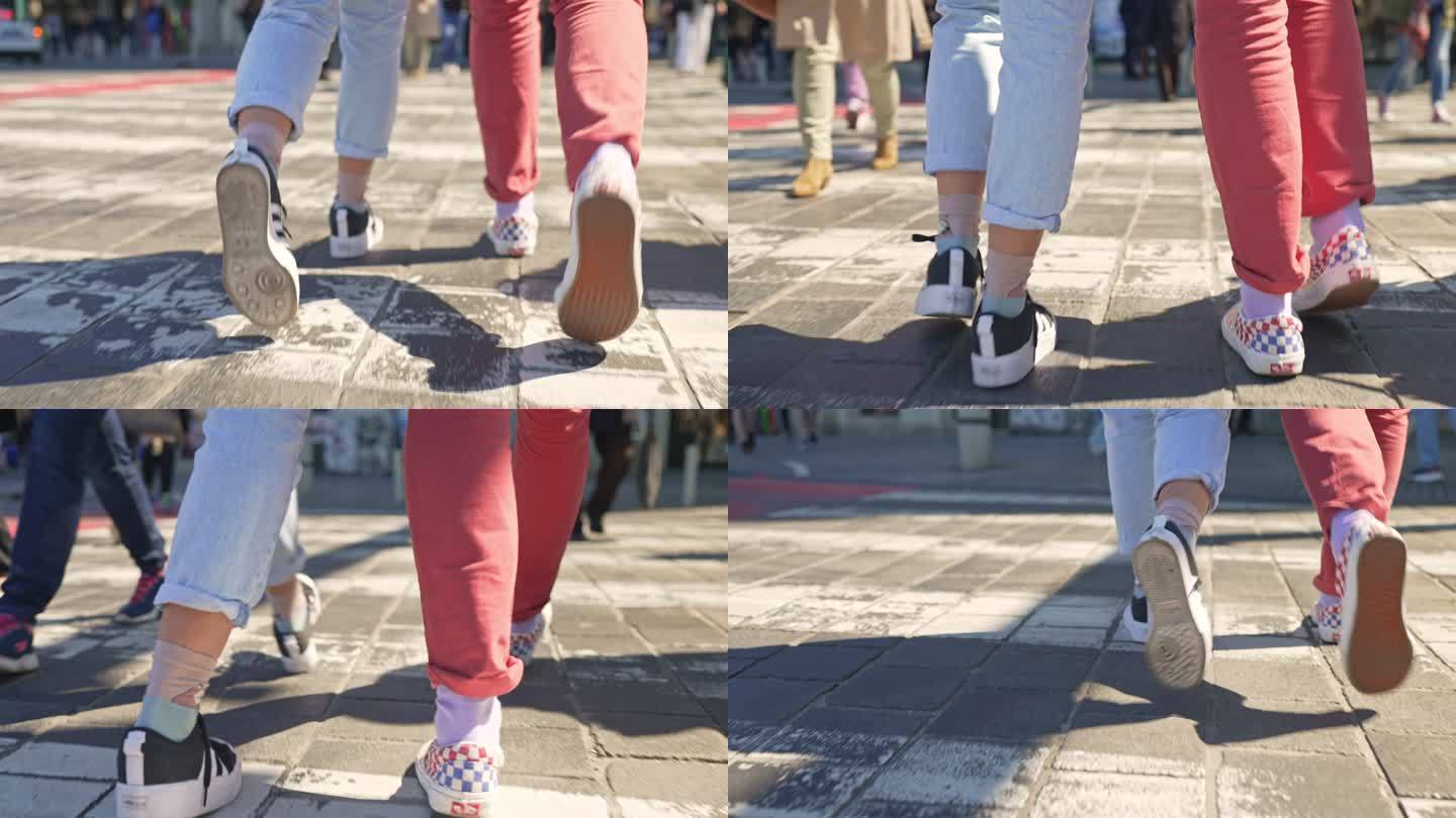 在人行横道上行走的腿部人物特写