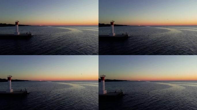 日出时的灯塔，鸟在飞翔，加拿大奥克维尔