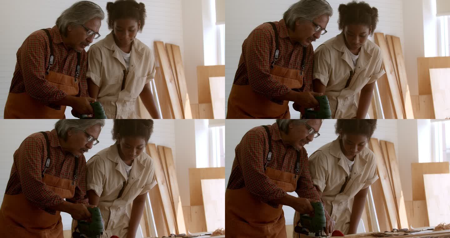 老师正在教一个学生使用木材切割机。