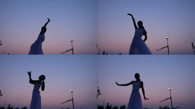 夕阳下女孩穿着白色连衣裙在跳舞